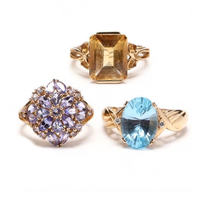 three-gold-and-gem-set-rings