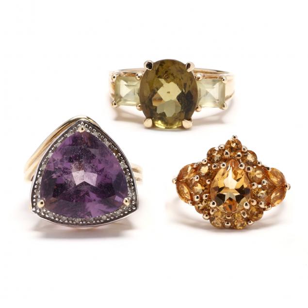 three-gold-and-gem-set-rings