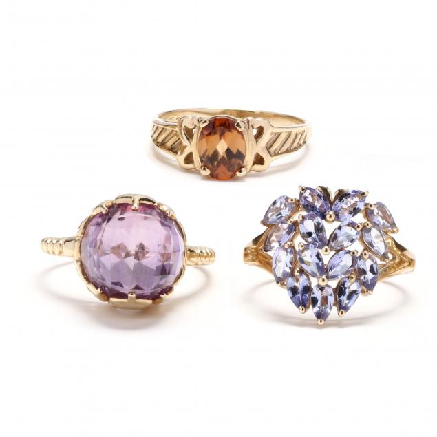 three-gold-and-gem-set-rings