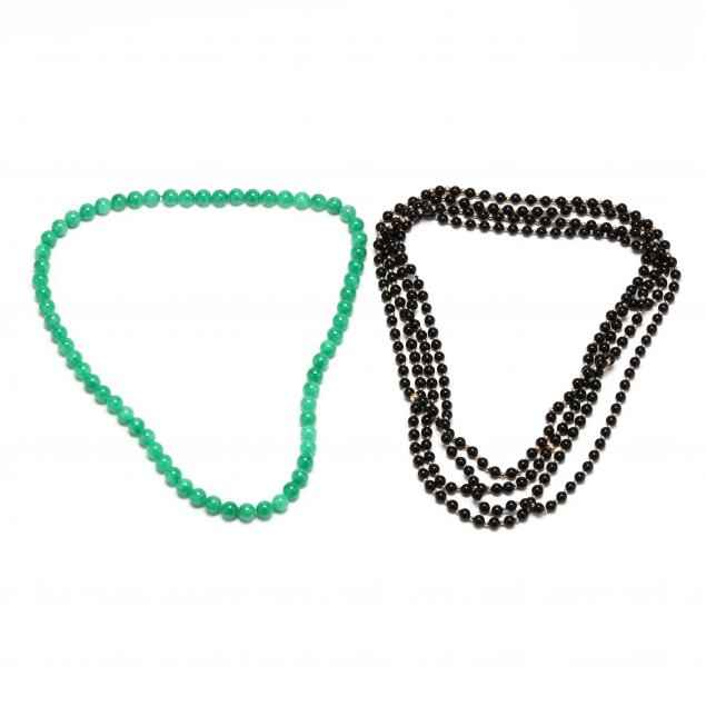 four-black-jade-bead-necklaces-and-a-green-jade-bead-necklace