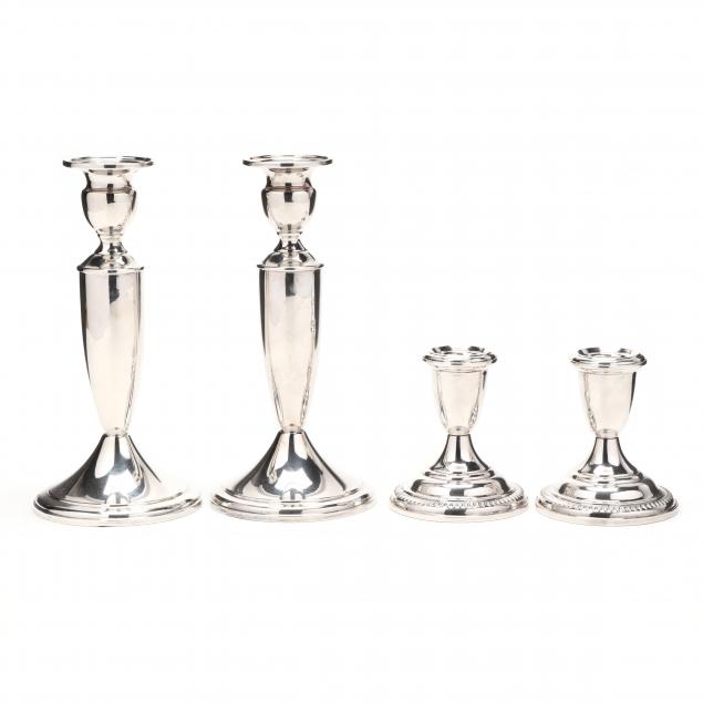 two-pairs-of-sterling-silver-candlesticks