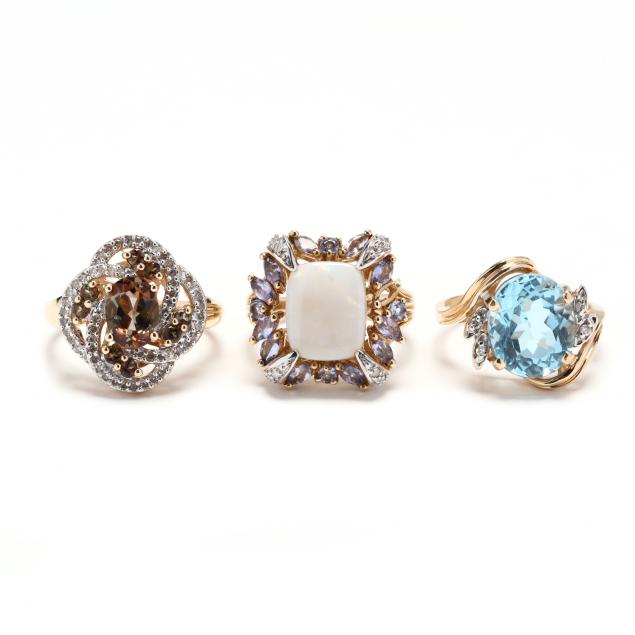 three-bi-color-gold-and-gem-set-rings