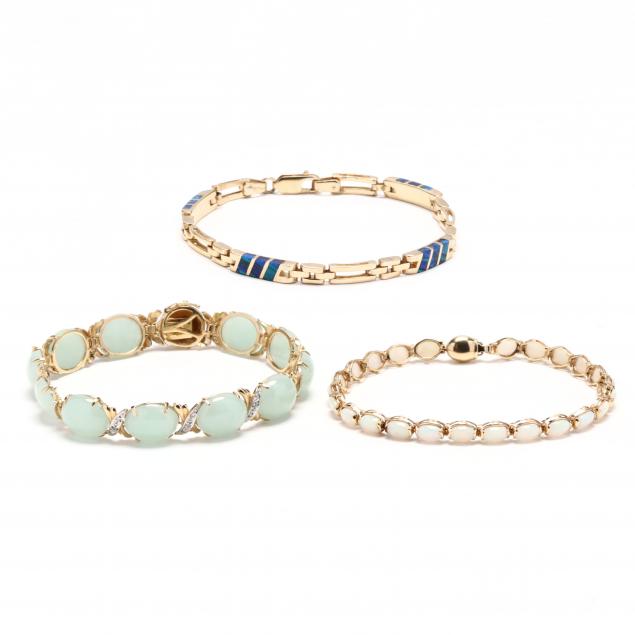 three-gold-and-gem-set-line-bracelets