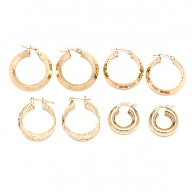 four-pairs-of-gold-hoop-earrings