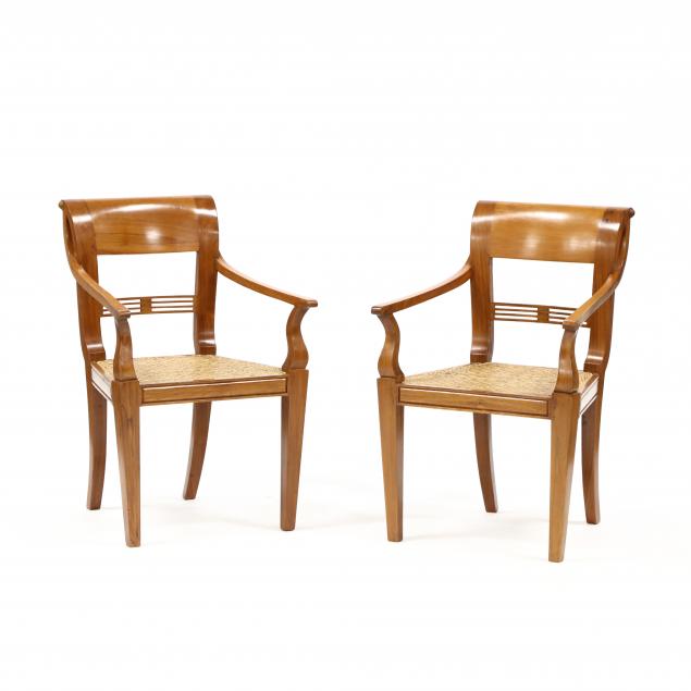 a-pair-of-southeast-asian-carved-teak-armchairs