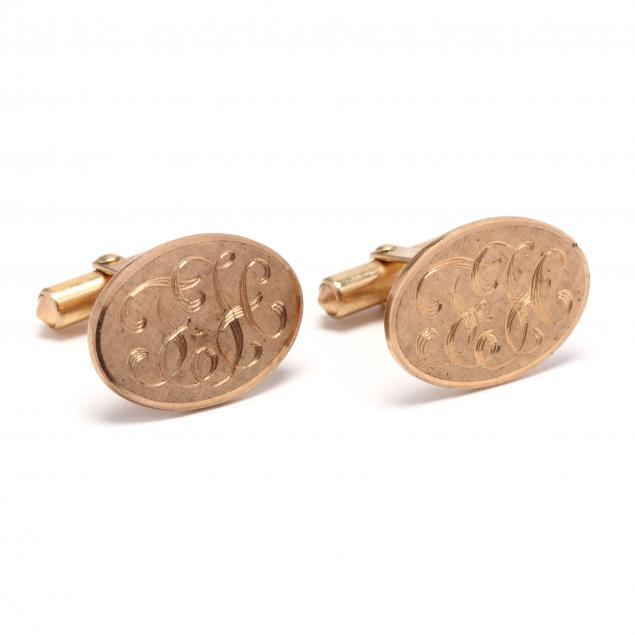 pair-of-gold-cufflinks