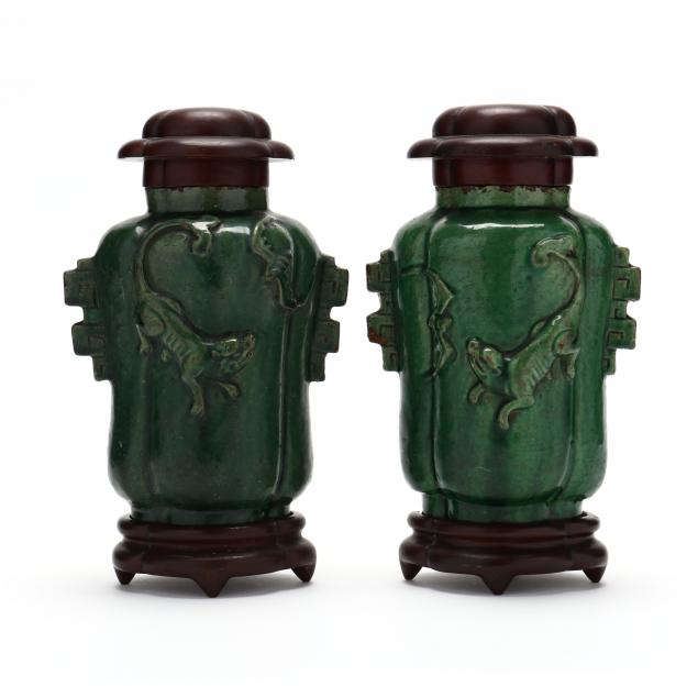 a-pair-of-chinese-green-glazed-jars-with-covers