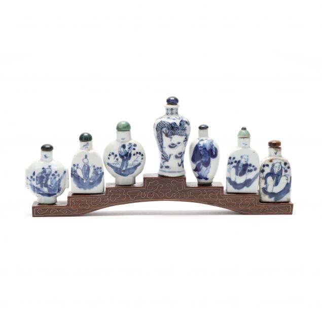 a-group-of-seven-chinese-blue-and-white-porcelain-snuff-bottles