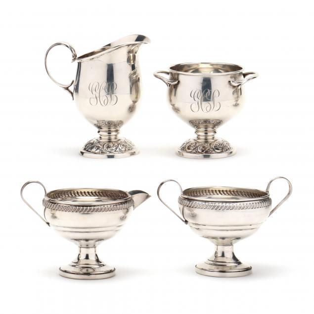 two-pairs-of-sterling-silver-creamers-and-sugars