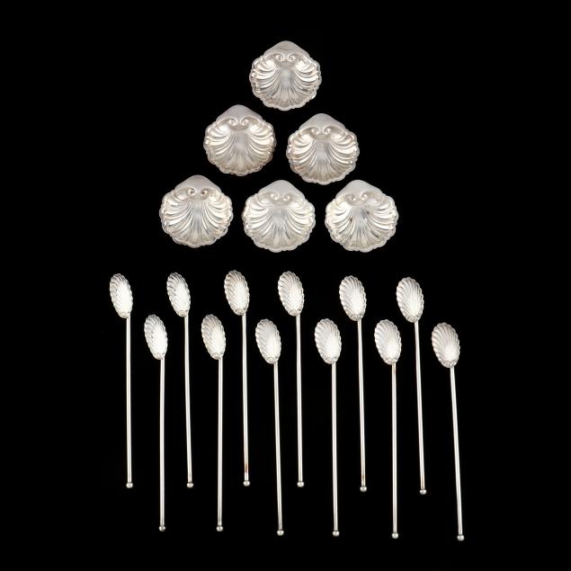 a-grouping-of-sterling-silver-shell-dishes-and-straw-stirrers