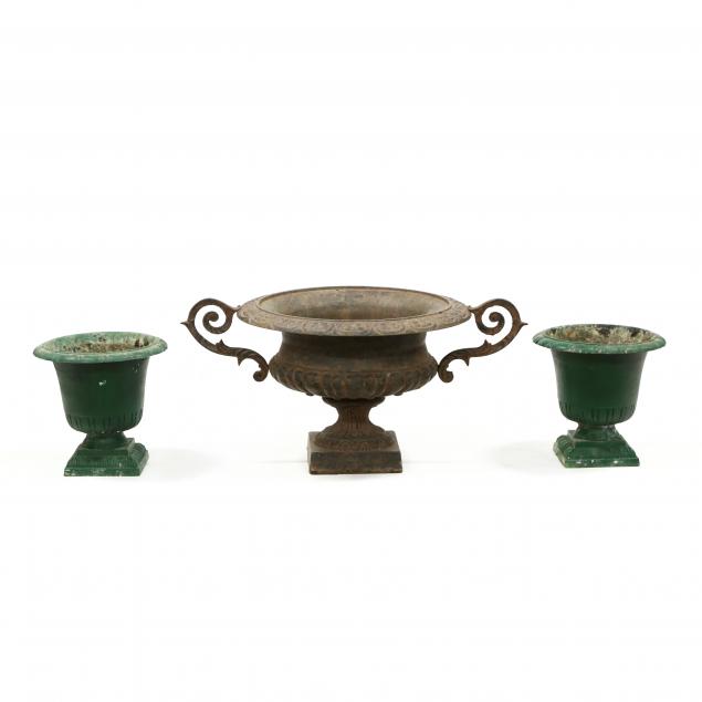 three-cast-metal-garden-urns