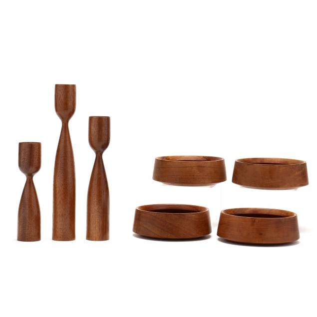 a-grouping-of-danish-teak-bowls-and-candlesticks