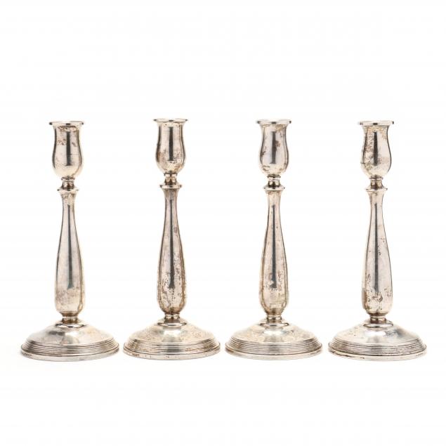 a-set-of-four-sterling-silver-candlesticks-by-fisher-silversmiths