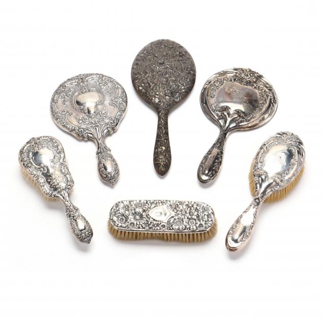 an-assembled-grouping-of-sterling-silver-repousse-vanity-items