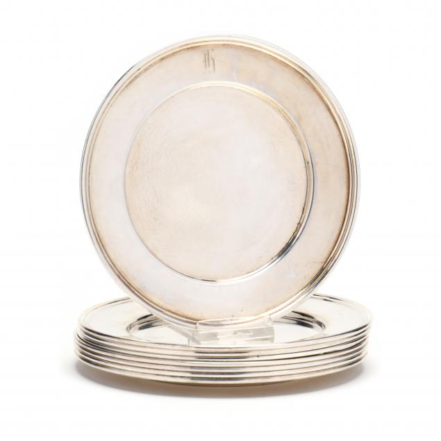 a-set-of-eight-sterling-silver-bread-plates-by-cartier