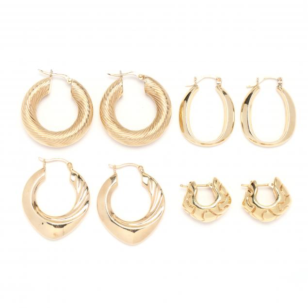 four-pairs-of-gold-hoop-earrings