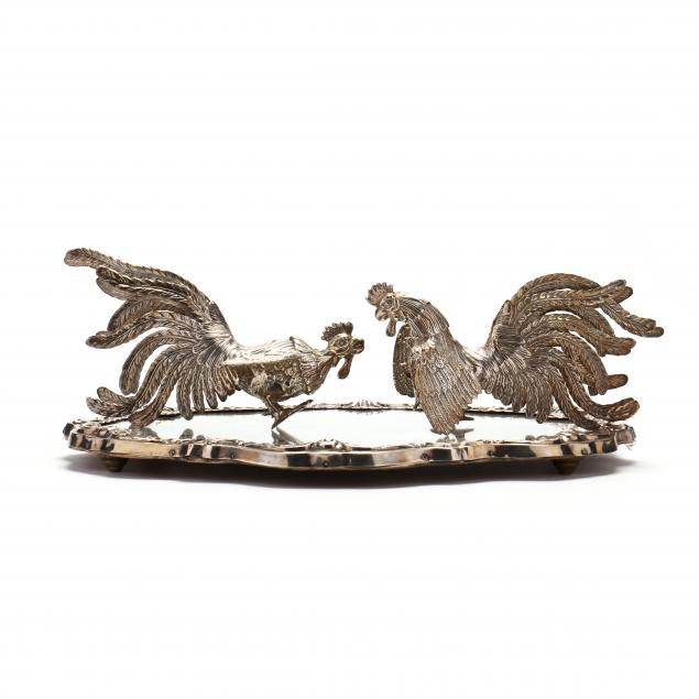 a-pair-of-sterling-silver-fighting-cocks-with-mirrored-plateau