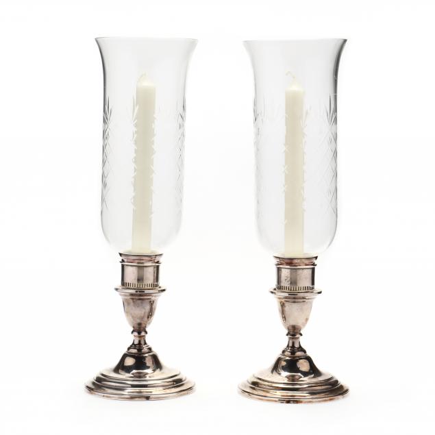 a-pair-of-international-i-lord-saybrooke-i-sterling-silver-candlesticks-with-hurricane-globes