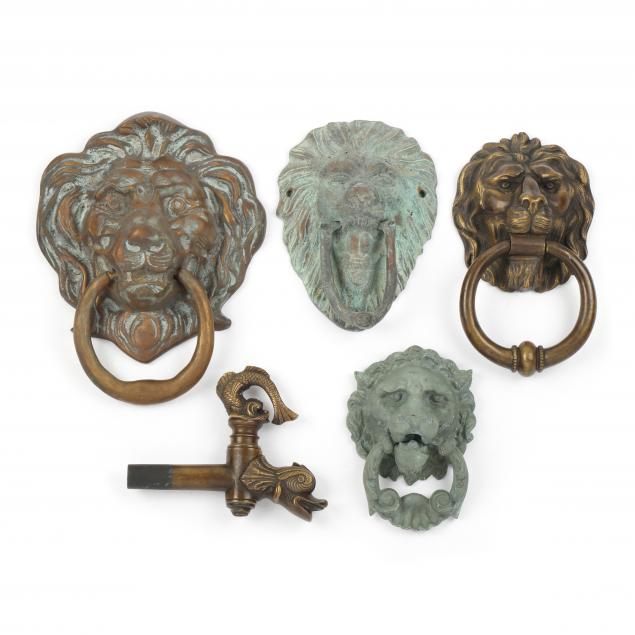 four-lion-mask-door-knockers-and-dolphin-spigot