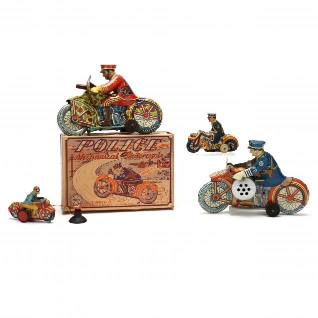 a-selection-of-four-vintage-cycle-toys
