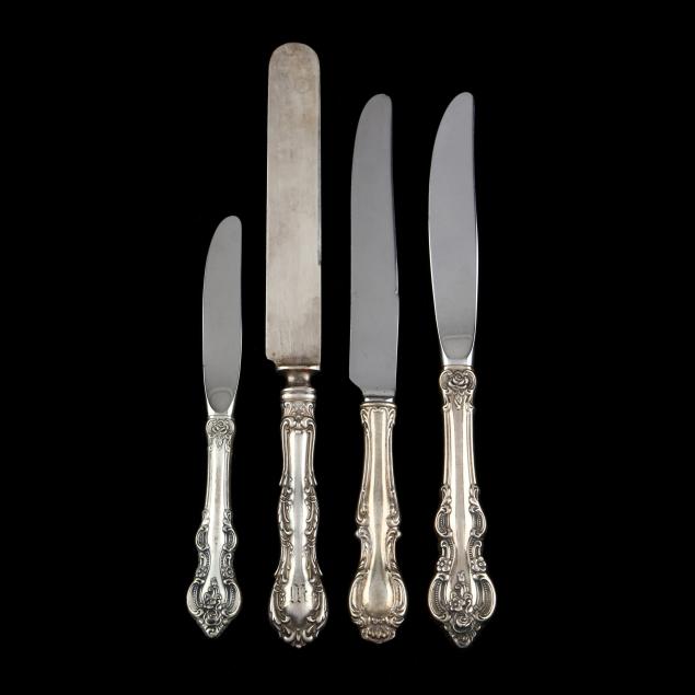 a-group-of-sterling-silver-knives