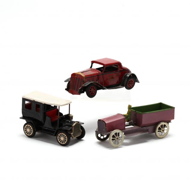 three-vintage-toy-vehicles