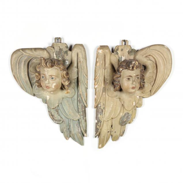pair-of-carved-and-painted-putti-head-wall-plaques