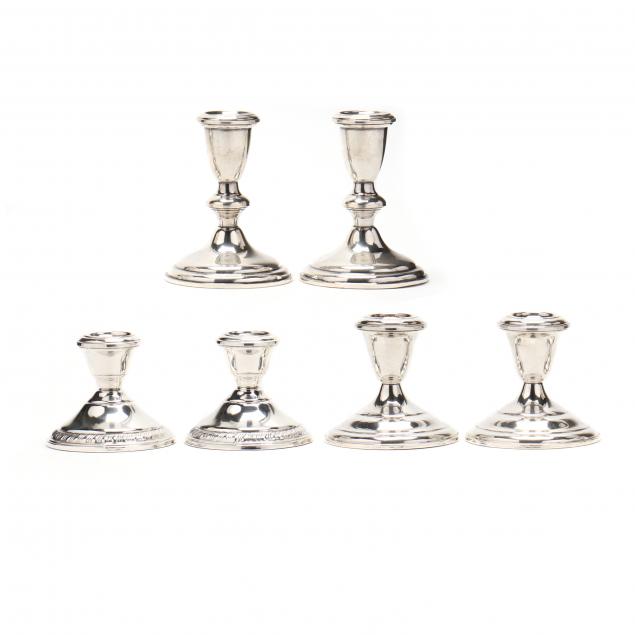 three-pairs-of-sterling-silver-candlesticks
