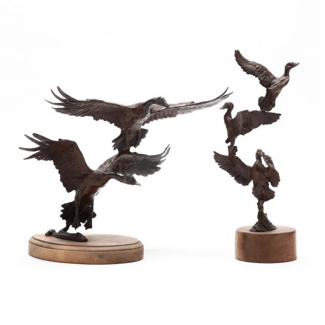 two-patinated-cast-bronze-sculptures-of-waterfowl-in-flight