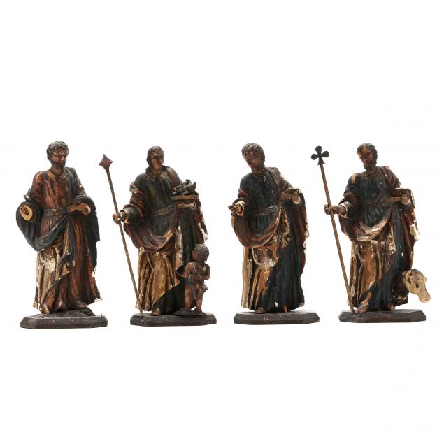 four-antique-carved-wood-santos-figures