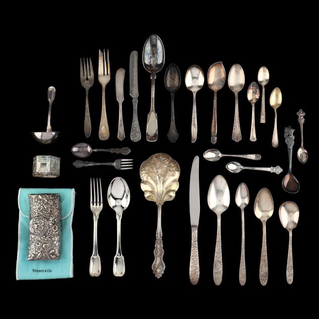 a-grouping-of-silverplate-flatware-and-accessories