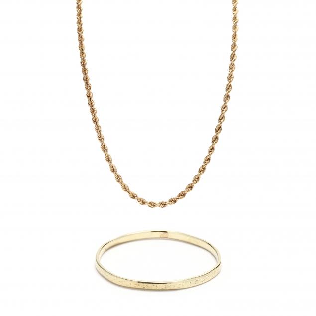 a-gold-bracelet-and-a-necklace