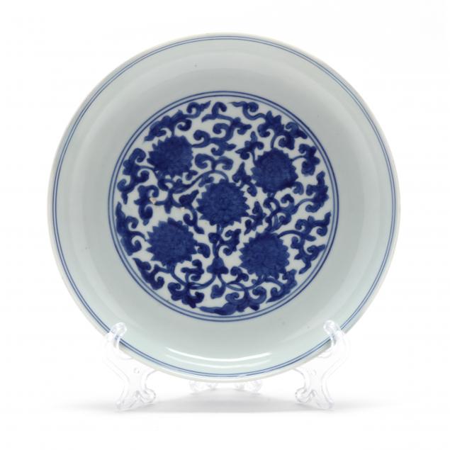 a-chinese-blue-and-white-porcelain-dish-with-lotus-phoenix-and-dragon