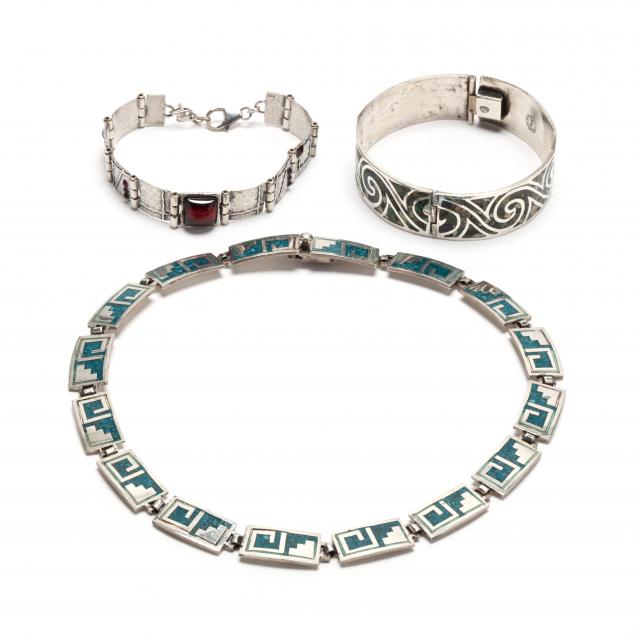 three-silver-jewelry-items