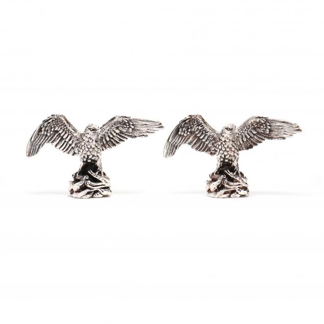 two-silver-clad-eagle-sculptures