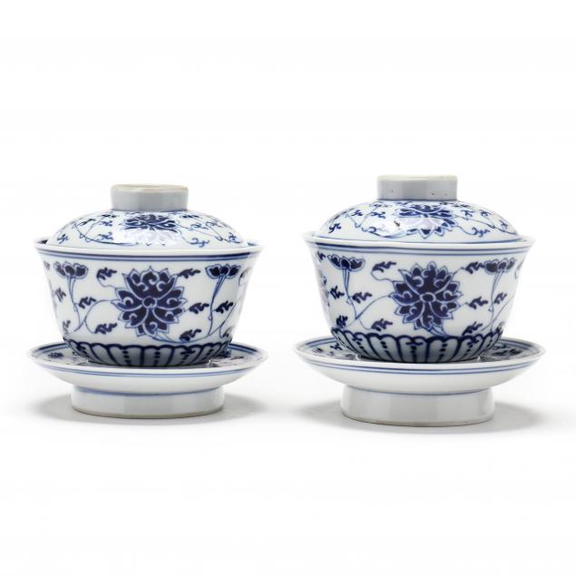 a-pair-of-chinese-blue-and-white-lotus-covered-bowls-on-cup-stands