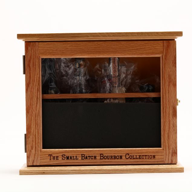 small-batch-bourbon-collection-in-wooden-display-case