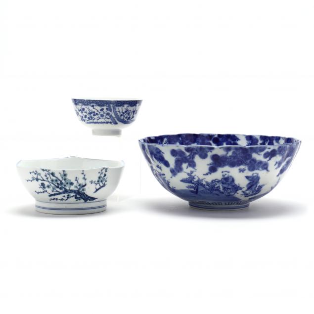 a-group-of-three-asian-blue-and-white-bowls