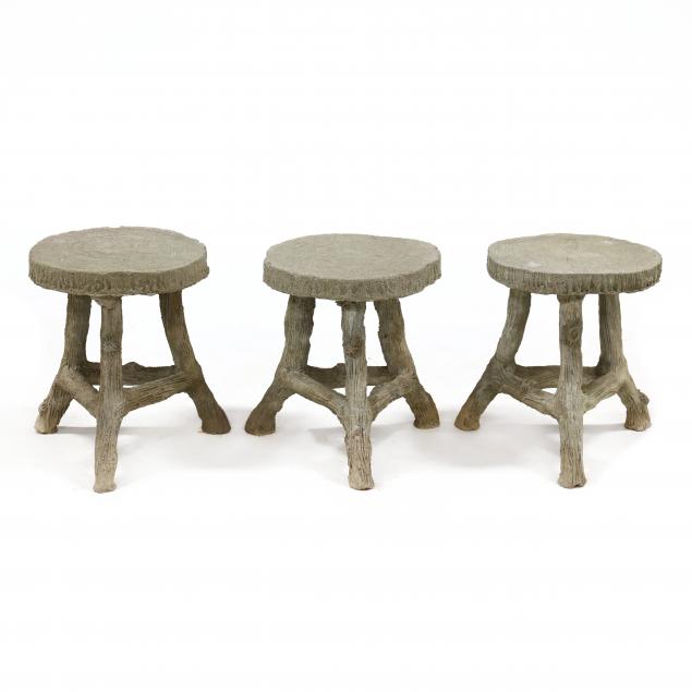 a-set-of-three-cast-stone-faux-bois-round-stools