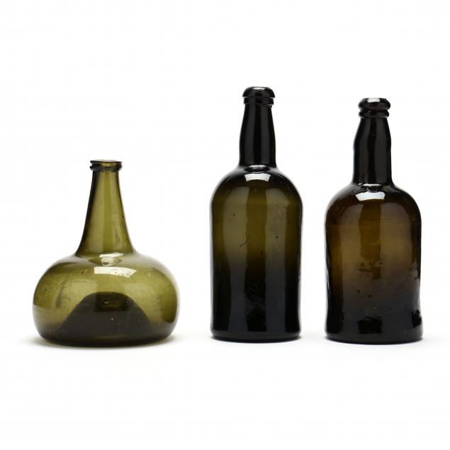 three-early-green-glass-bottles