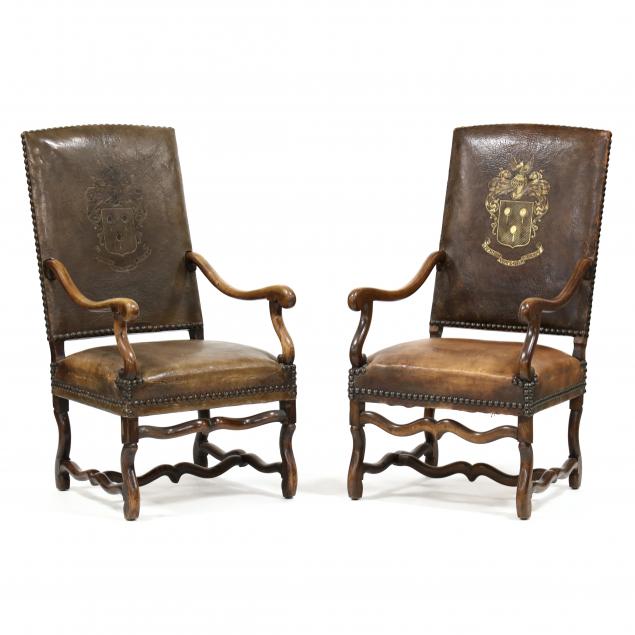 pair-of-spanish-armorial-leather-upholstered-armchairs