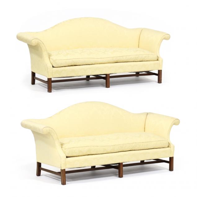 pair-of-chippendale-style-camel-back-upholstered-sofas