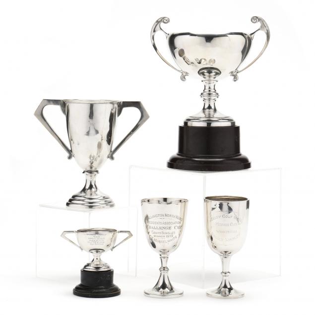 a-grouping-of-five-english-silver-trophies