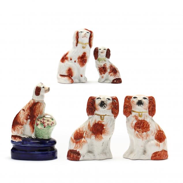 a-group-of-five-antique-staffordshire-spaniels