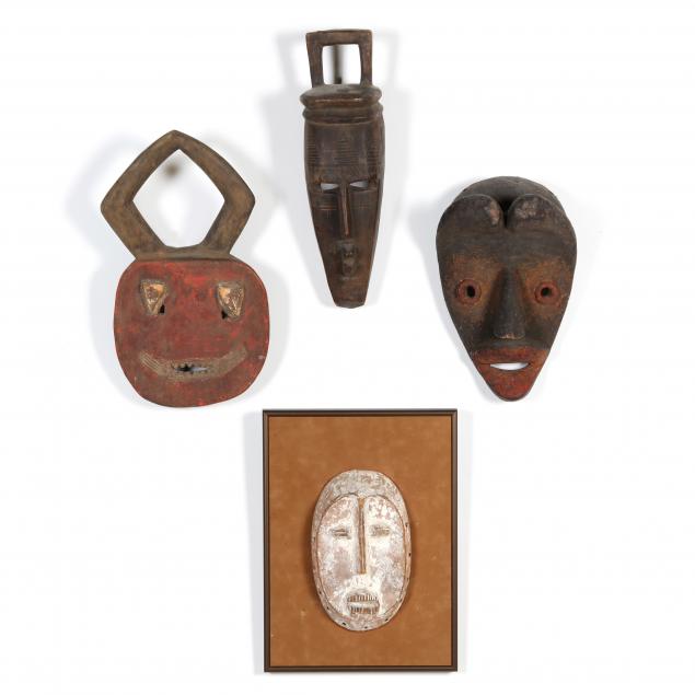 four-african-masks-of-carved-wood