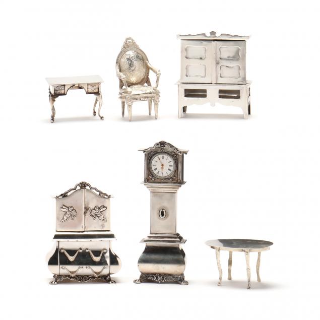 six-silver-miniature-models-of-dollhouse-furniture