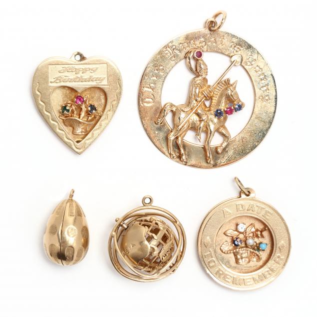 a-collection-of-vintage-gold-and-gold-and-gem-set-charms