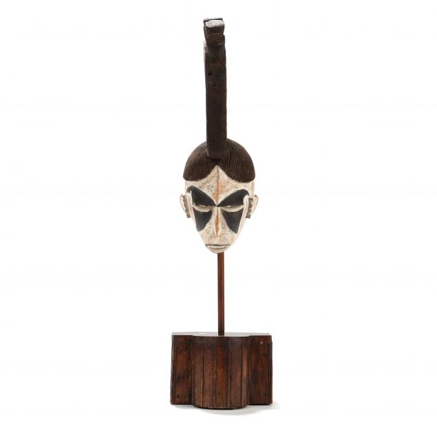 a-large-african-igbo-mask-on-stand
