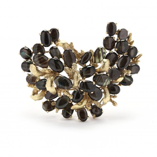 gold-and-black-star-sapphire-brooch