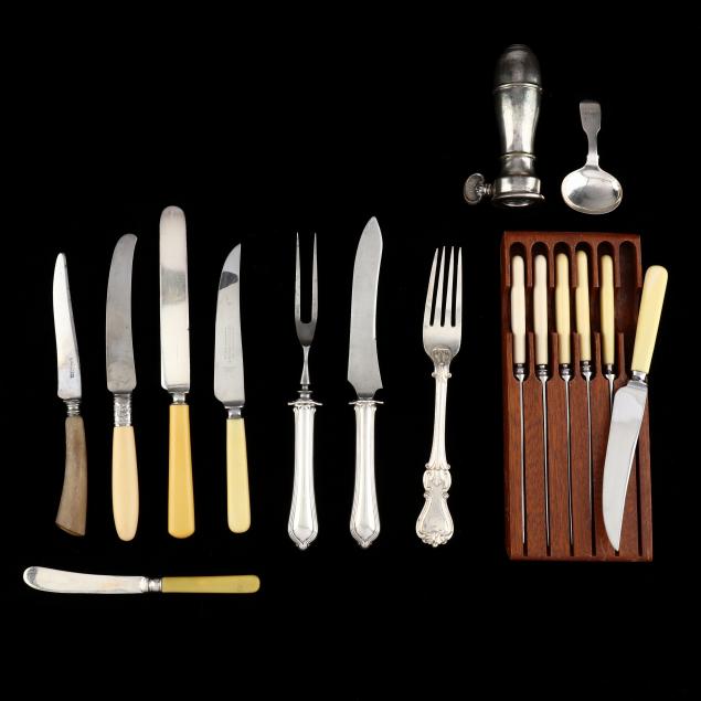 a-grouping-of-silverplate-and-stainless-handled-dinnerware-knives-and-table-articles